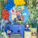 Arco de balões + três cilindros + mesa game +R$ 100,00